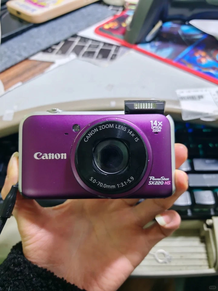 Cámara digital Canon PowerShot SX220 HS 12,1 mega píxeles zoom óptico 14x púrpura Foto 2 de 4