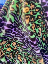 Purple /Green colored Leopard Spotted shaggy short pile faux fur fabric by yard
