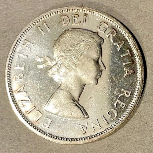 1961 Canadian Silver Dollar — 80% Silver Voyageur - Brilliant