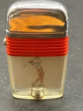 Vintage Scripto Male Golfer Pocket Lighter, Red Band.