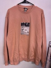 H M Women  s Size L Salmon Colored Graphic Sweatshirt