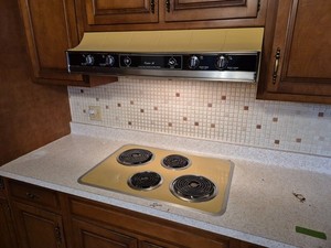 vintage GE electric cooktop with vent and wall oven