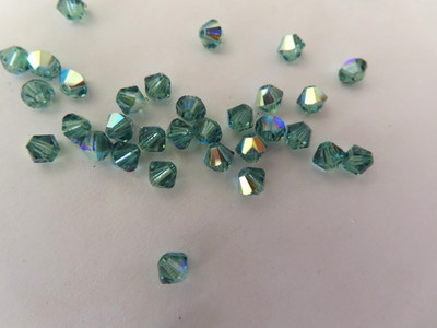 36 Swarovski Bicone Beads 4mm Erinite AB. #5328
