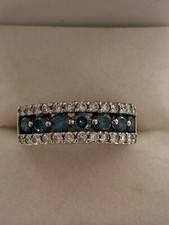 1.12CTW FANCY BLUE RADIATED DIAMOND and .52CTW of Round brilliant diamond ring