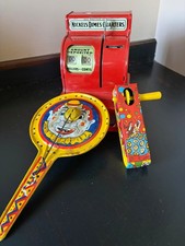 LOOK : vintage tin toys: cash register, a clown clapper, a twirl noise maker
