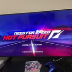 PS3 Need for Speed Hot Pursuit Rivals Run cover with blue-toned road scene and matching PS3 game case.