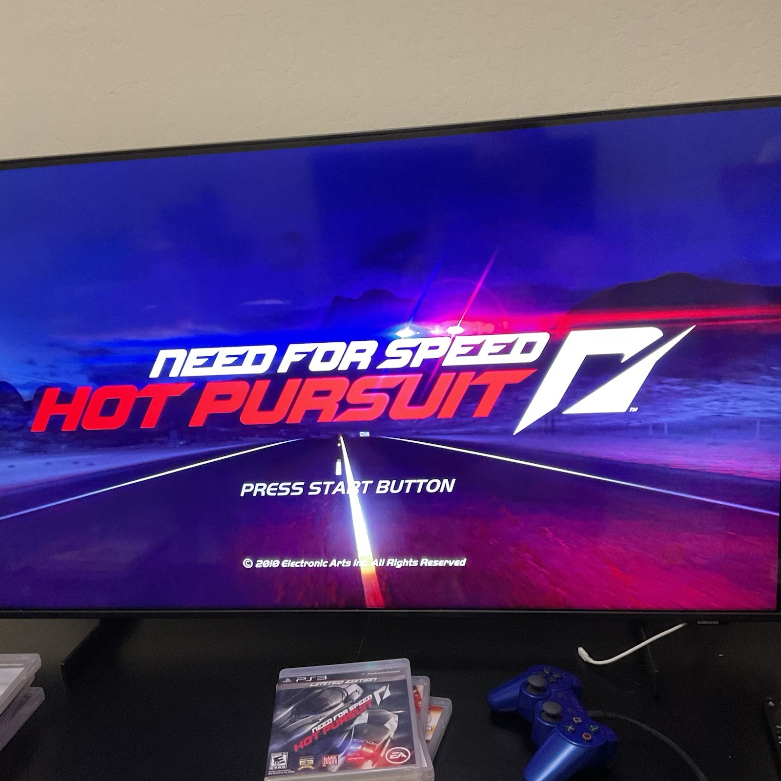PS3 Need for Speed Hot Pursuit Rivals Run cover with blue-toned road scene and matching PS3 game case.