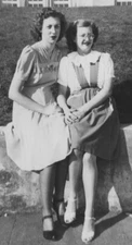 1940s Two Women Sitting Together Friends Glasses Smiling Sunshine Fence