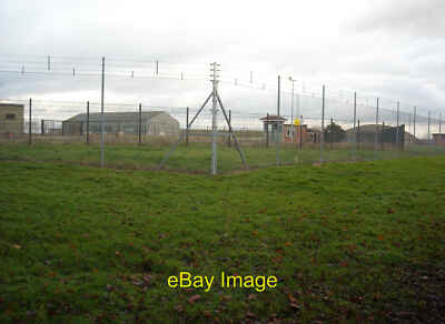 Photo 6x4 RAF Lyneham airfield Ancillary buildings and a hangar on the di c2014