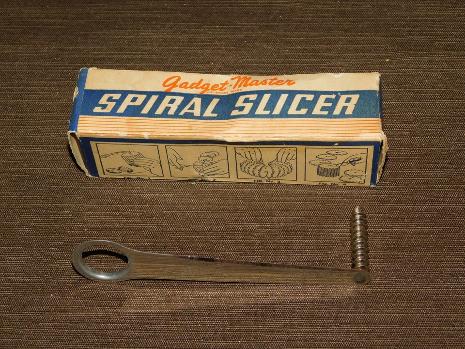 A still-boxed vintage Gadget Master spiral slicer — a compact, single-purpose kitchen contraption that looks straight out of a 1960s housewife catalogue.