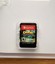 White Nintendo Switch Crash Bandicoot N Sane Trilogy case with colorful mountain and forest scene on front.