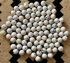 100 golf balls in near mint condition 4A . Assorted brands and models.
