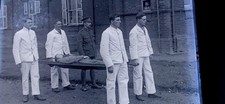 GLASS NEGATIVE PHOTO WWI ARMY MAN ON STRETCHER  WOUNDED HOSPITAL
