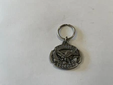 SISKIYOU BUCKLE CO  KEY CHAIN   PROUD TO BE A VETERAN