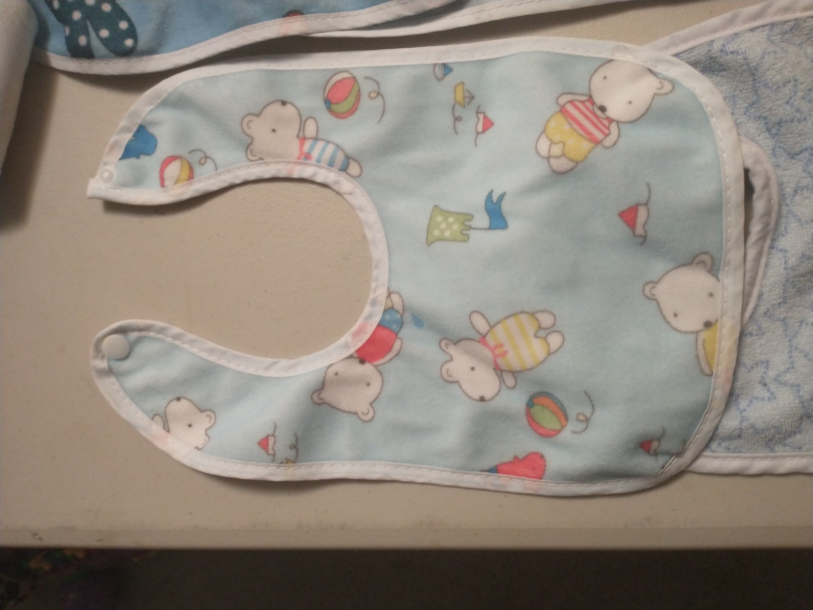 lot of 11 baby bibs some Neat Solutions cats rabbits bears ballons beach rainbow