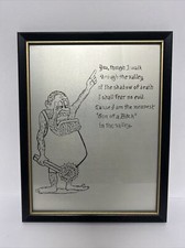 Framed Printed Drawing Of Caveman And Quote On Metal Surface