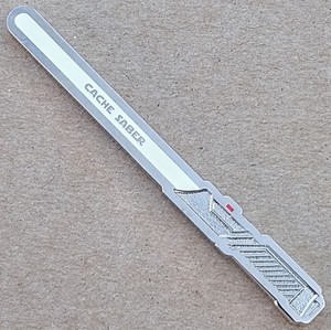 Cache Saber Geocoin - Shiny Nckl. w White Glow - Activated & ADOPTABLE - TB7DJA2