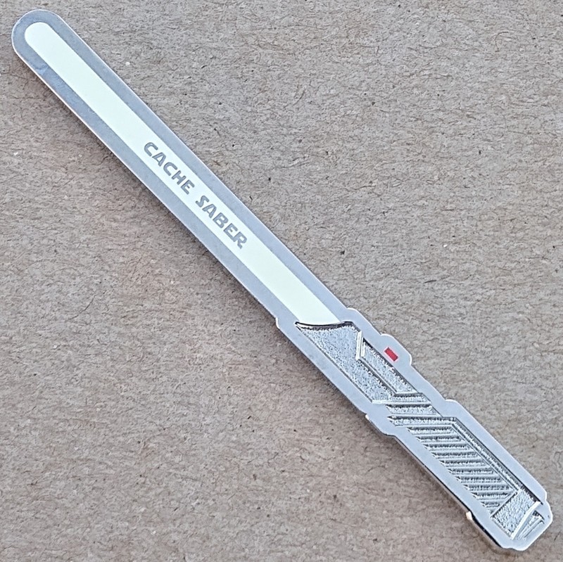 Cache Saber Geocoin - Shiny Nckl. w White Glow - Activated & ADOPTABLE - TB7DJA2