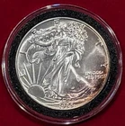 1988 AMERICAN EAGLE ONE OUNCE SILVER DOLLAR WITH COIN HOLDER