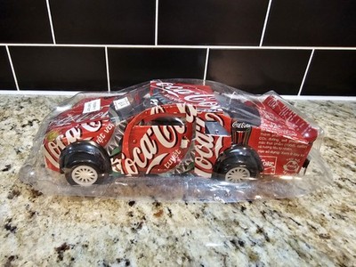 Handmade model car crafted from recycled Coca-Cola cans