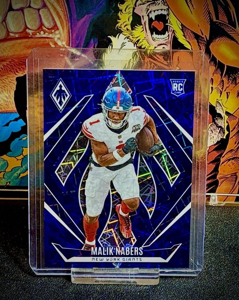2024 Panini Phoenix Football Malik Nabers Blue Lazer /125 RC #221