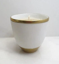 L'OBJET GOLD AND WHITE CANDLE **SEE DETAILS
