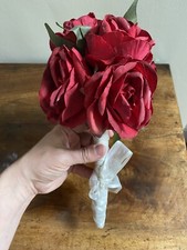 Tied bouquet of Antiqued Large Artificial Red Roses with white ribbon tie