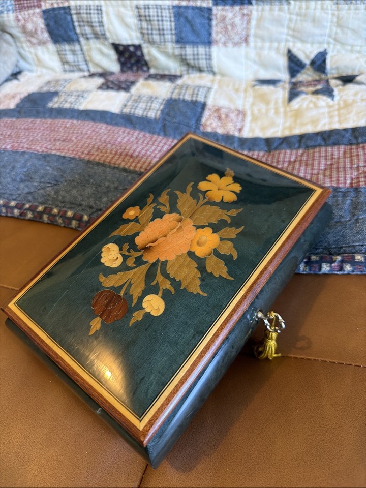 A genuine Swiss-movement Reuge music box made in Italy playing 'Come Back to Sorrento' — Reuge is the Rolex of music boxes.