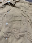 Light brown vintage Fruit Of The Loom men’s button up shirt, size small, with two front chest pockets and button-down collar.