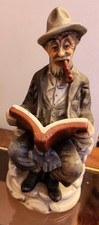 Vintage Ceramic Figurine -  an old Man Sitting and Reading a Book Smoking a Pipe