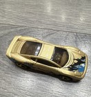 Hot Wheels Jaguar XJ220 * Color: Dorado metálico con gráficos azules y negros — photo 2