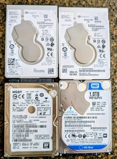 Lot of (4) 1TB SATA 2.5" Mixed Brands Laptop Hard Drives. Checked Good W/Crystal