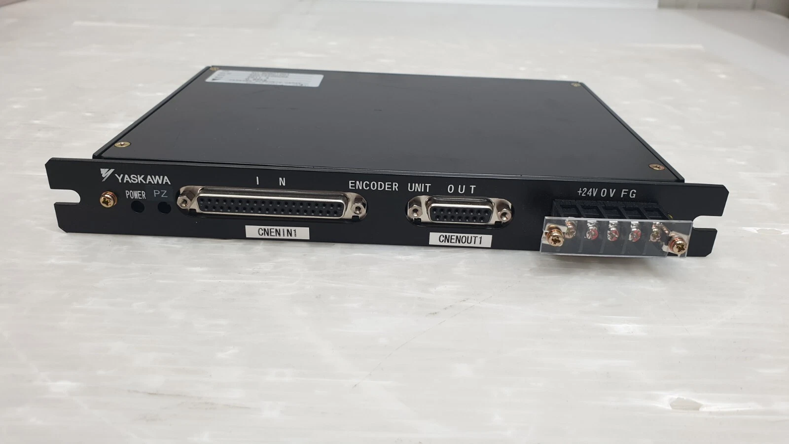 Front panel of the XU-BDB0100T marked ENCODER UNIT with IN and OUT connectors