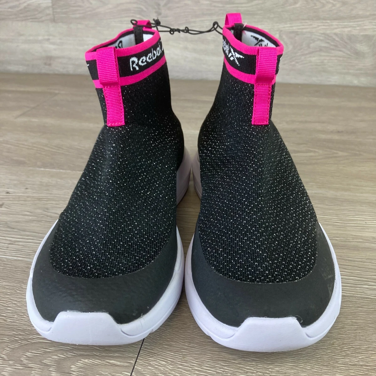Black and top pink reebok shoes