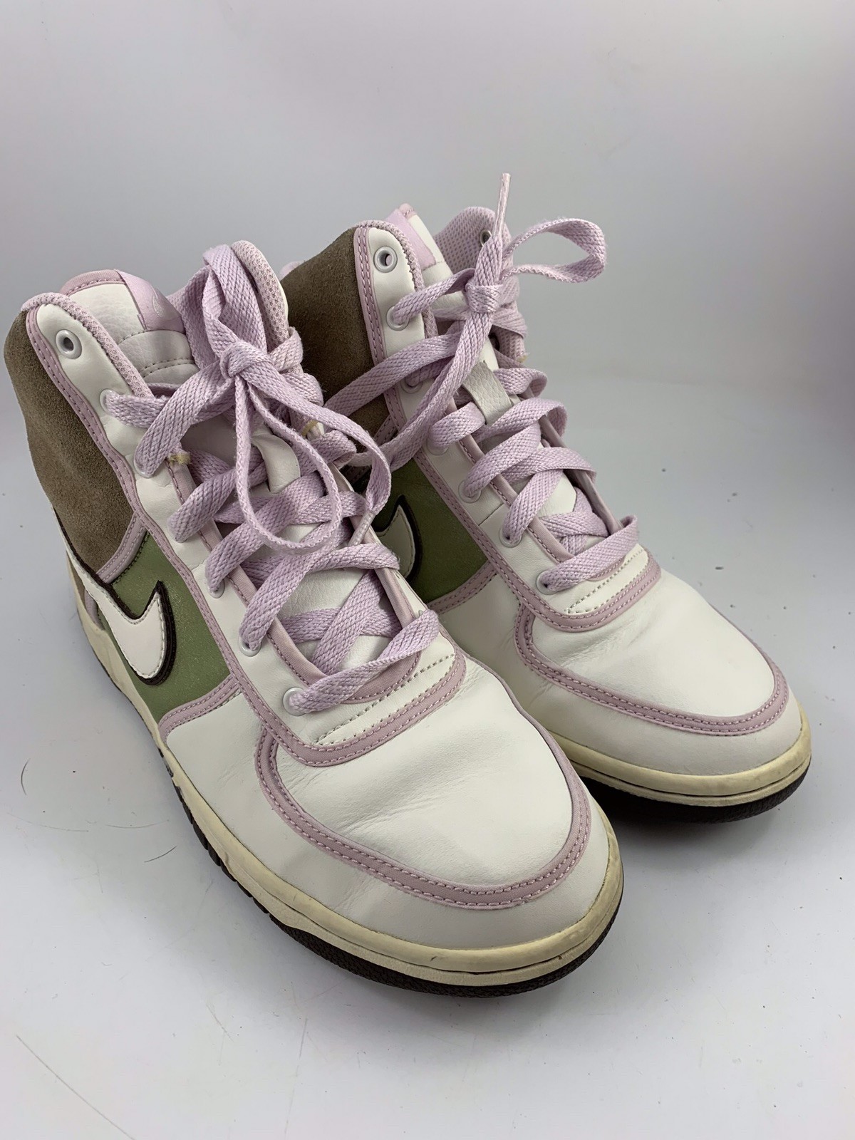 pink and white nike tennis shoes