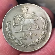 MONETA 20 RIAL ( 1973 - 1978 ) leggermente piegata