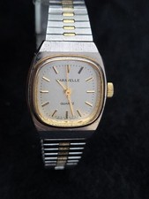 Caravelle by Bulova women's dress watch, square white with gold accents