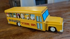 TIRELIRE BUS SCOLAIRE SNOOPY en résine