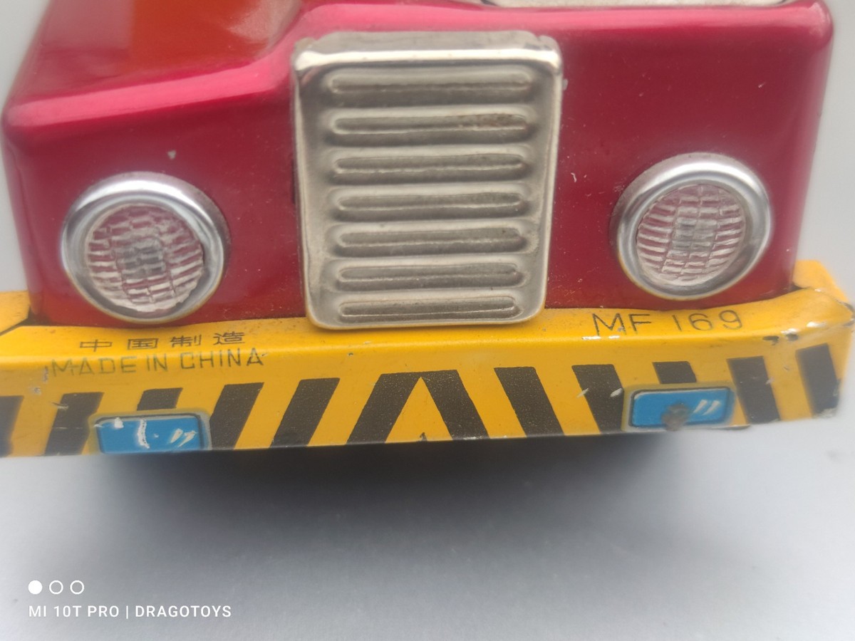 VINTAGE TOY DUMP TRUCK MF 169 AND DRIVER FRICTION POWERED