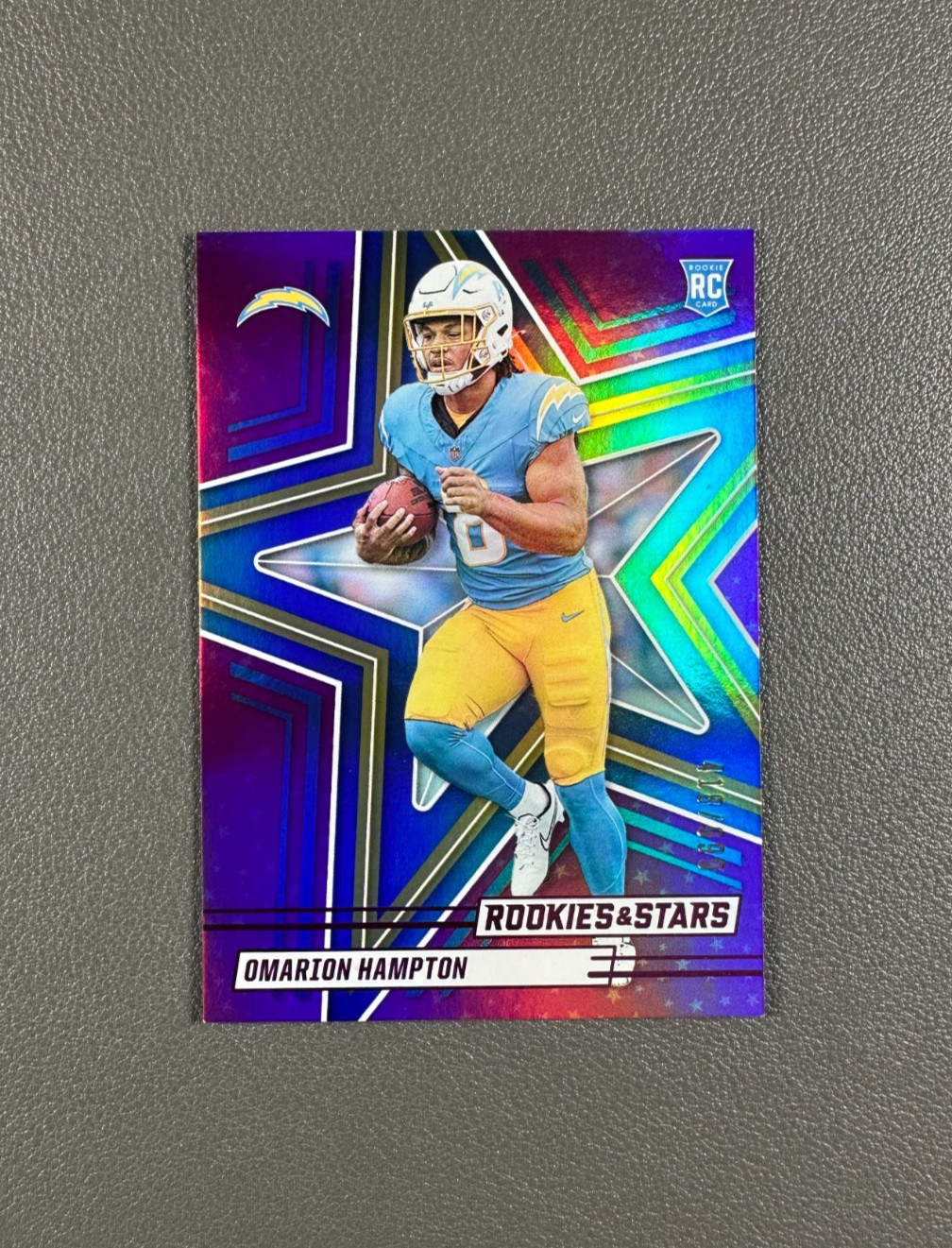 2025 Panini Rookies & Stars Omarion Hampton /999 Rookie Holo Purple RC #166