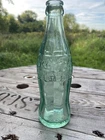 1942 Embossed Coca-Cola Glass Bottle.Rhinelander Wisconsin. Vintage Hobbleskirt