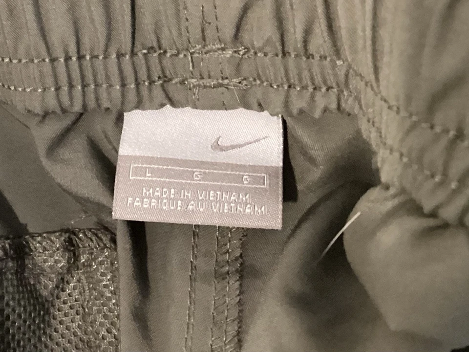 Pantalones de chándal de carga Nike para hombre talla grande verde cremallera pierna malla ventilaciones bolsillos Foto 3 de 4