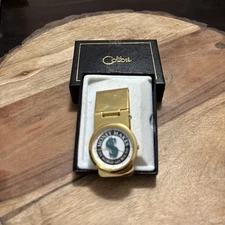 Colibri money clip makes world go round. New In Box. Needs Battery
