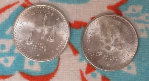 for sale are two 1979 & 1980 1oz Silver Onza AU/BU