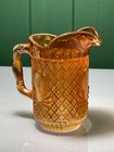 VINTAGE ORANGE IRRIDESCENT CARNIVAL ART GLASS CREAM JUG WITH GEOMETRIC PATTERN