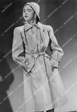 crp-11773 1944 news photo CBS radio star Julie Stevens models new stylized rainc