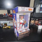 WWE Street Fighter Rey Mysterio Elite Collectible Figure Arcade Box
