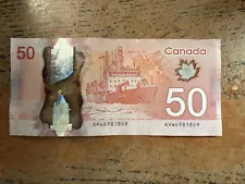 ULTRA RARE. 1 - $50 Canadian FLIP banknote. AHW6981869 Read description...