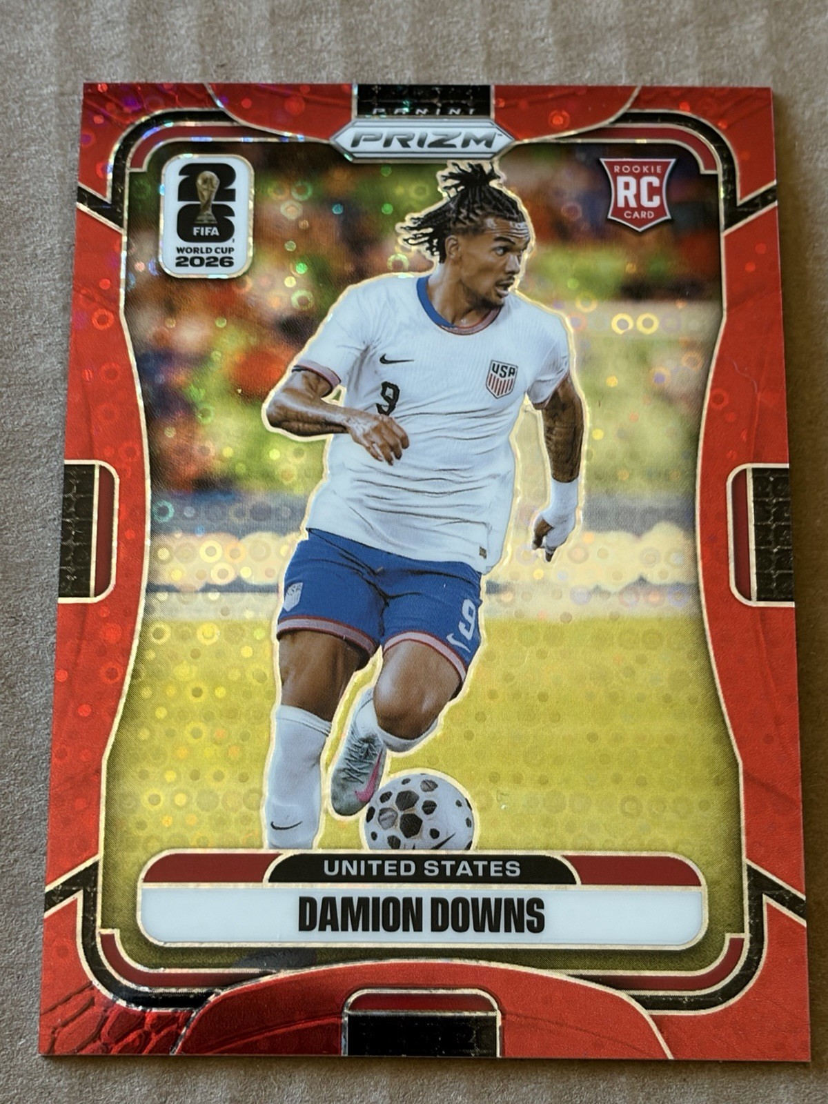 Damion Downs, Rookie Card on Red Disco Prizm numbered 85 out of 99