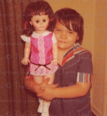 Vintage Photo 1970s Child Holding Large Doll in Retro Dress Indoors